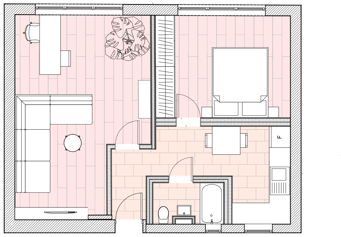 The proposed plan drawn in pink: the living room with its L-shaped sofa and desk, the bedroom behind a wardrobe wall, and the kitchen extended along the hallway past the bathroom.
